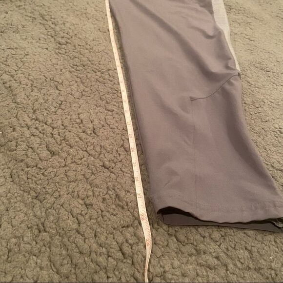 Under Armour Light Grey Wind Pants Sz Large Drawstring Side Zips Stripe on side - Picture 10 of 13